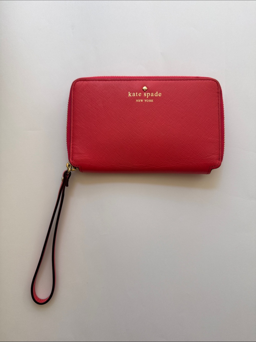 kate spade red saffiano zip wristlet with gold logo